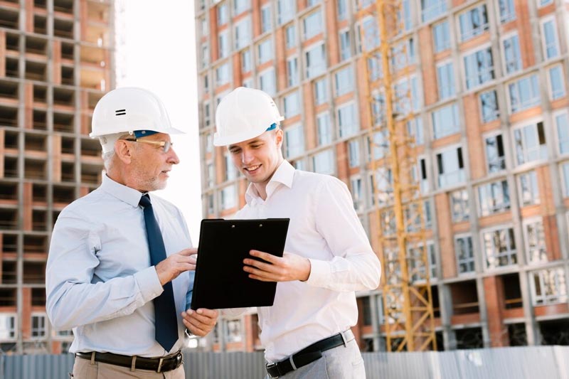 Two building consultants on construction site in Melbourne