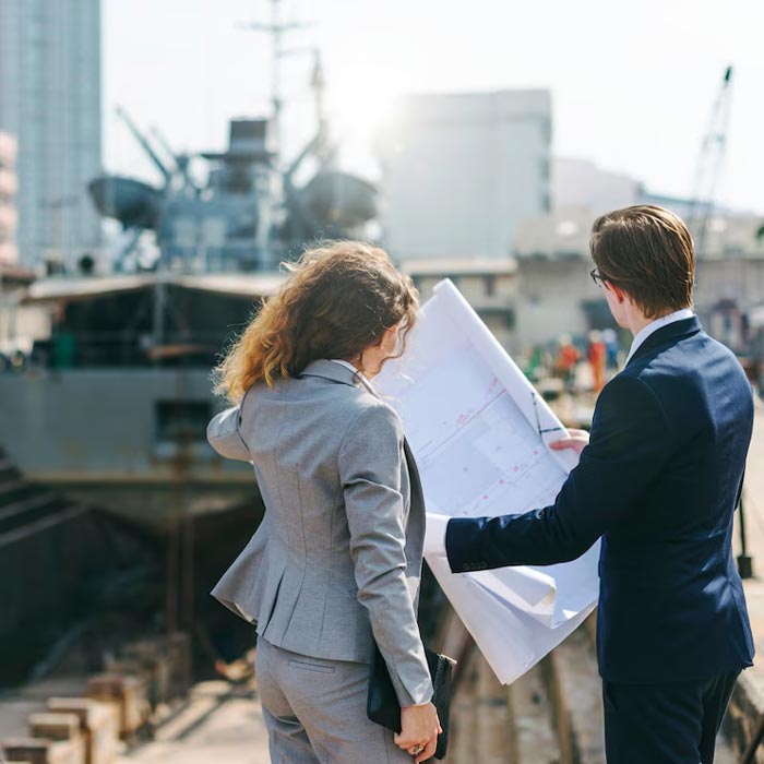 Two building consultants looking at house plans